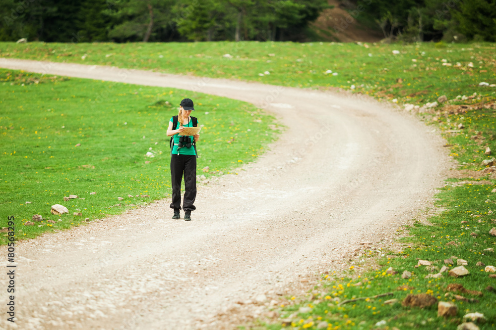 Fototapeta premium Hiker looking on map