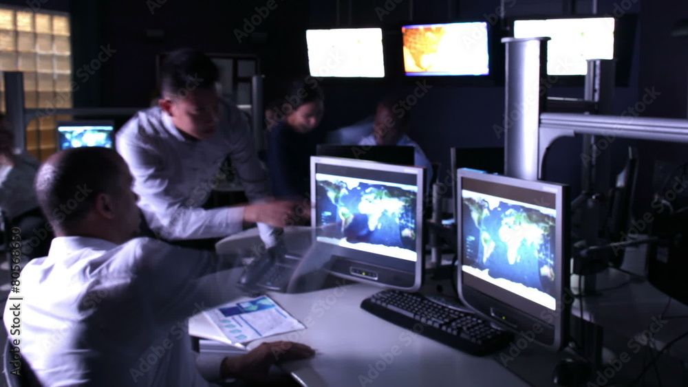 Time lapse security team watching the screens in busy control center office Time lapse security team watching the screens in busy control center office