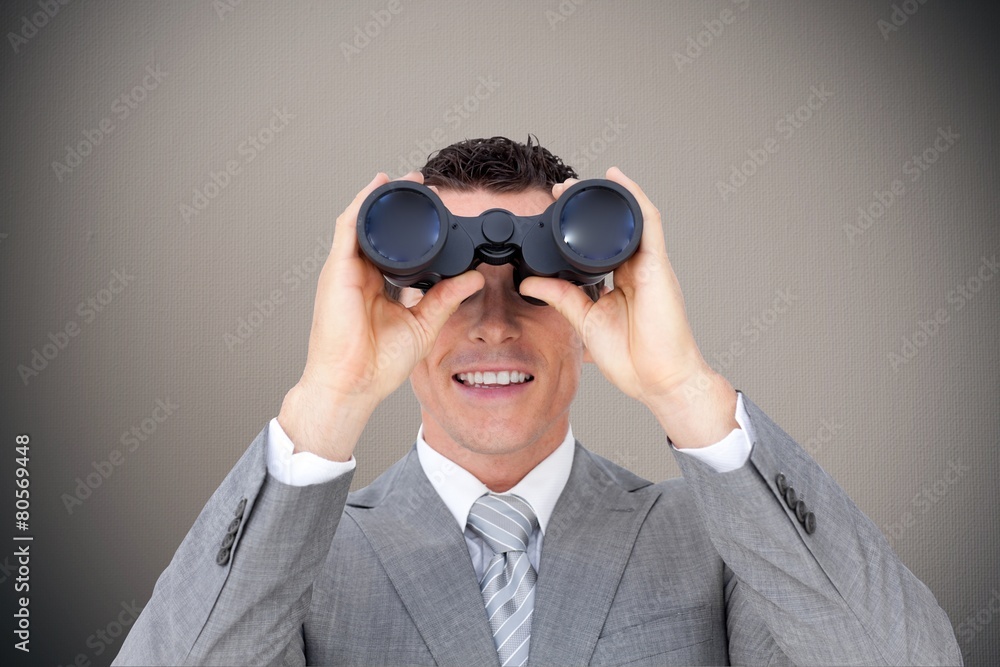 Composite image of businessman holding binoculars Composite image of businessman holding binoculars