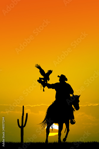 man on horse with hawk
