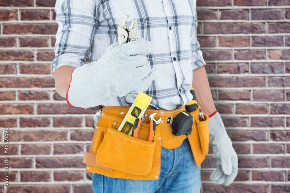 Technician with tool belt around waist Technician with tool belt around waist