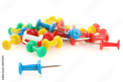 blue pushpin against other