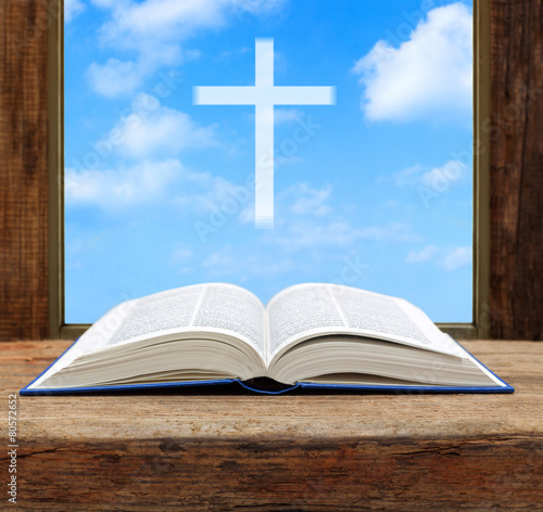 Bible open christian cross light sky view window wooden