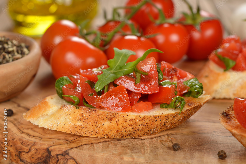 Bruschetta with tomatoes and arugula