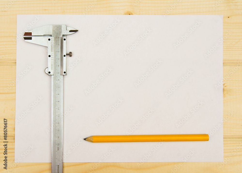 paper with the working tool on wooden background. paper with the working tool on wooden background.