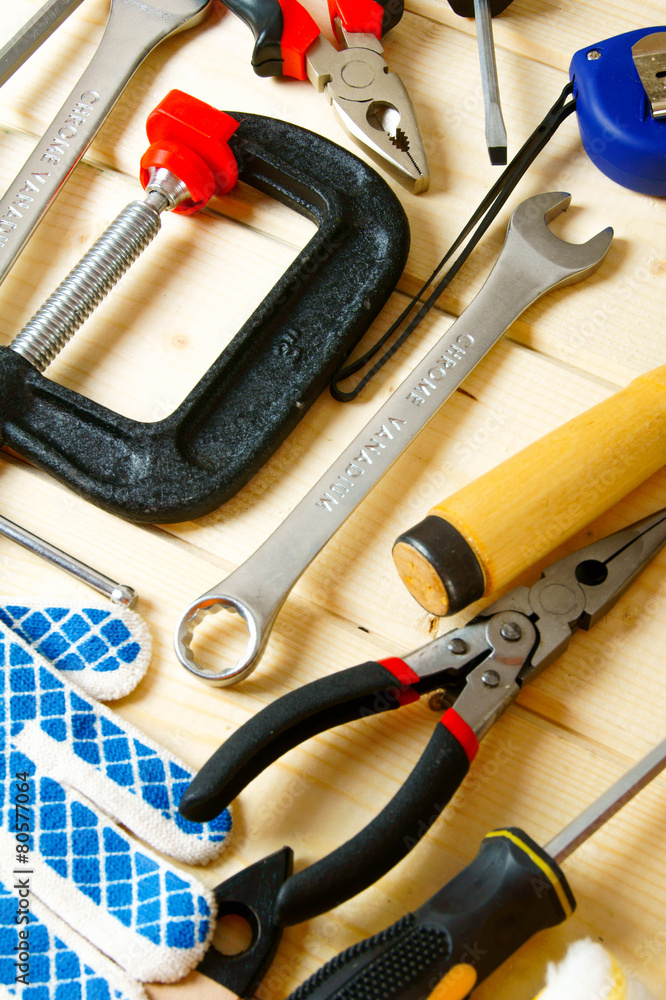 Many working tools on a wooden background. Many working tools on a wooden background.