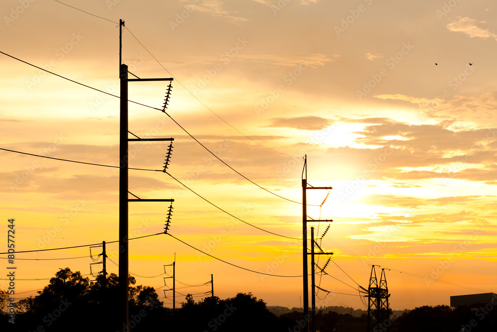 Electricity pole with sunset