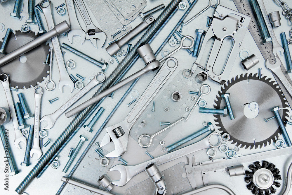 Fototapeta premium Many tools on the scratched metal background.