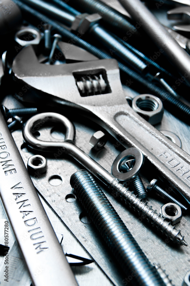 Fototapeta premium Wrench and tools on the scratched metal background.