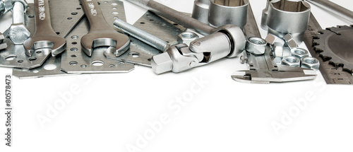 Metalwork. Ruler, wrench, screw and others tools on white
