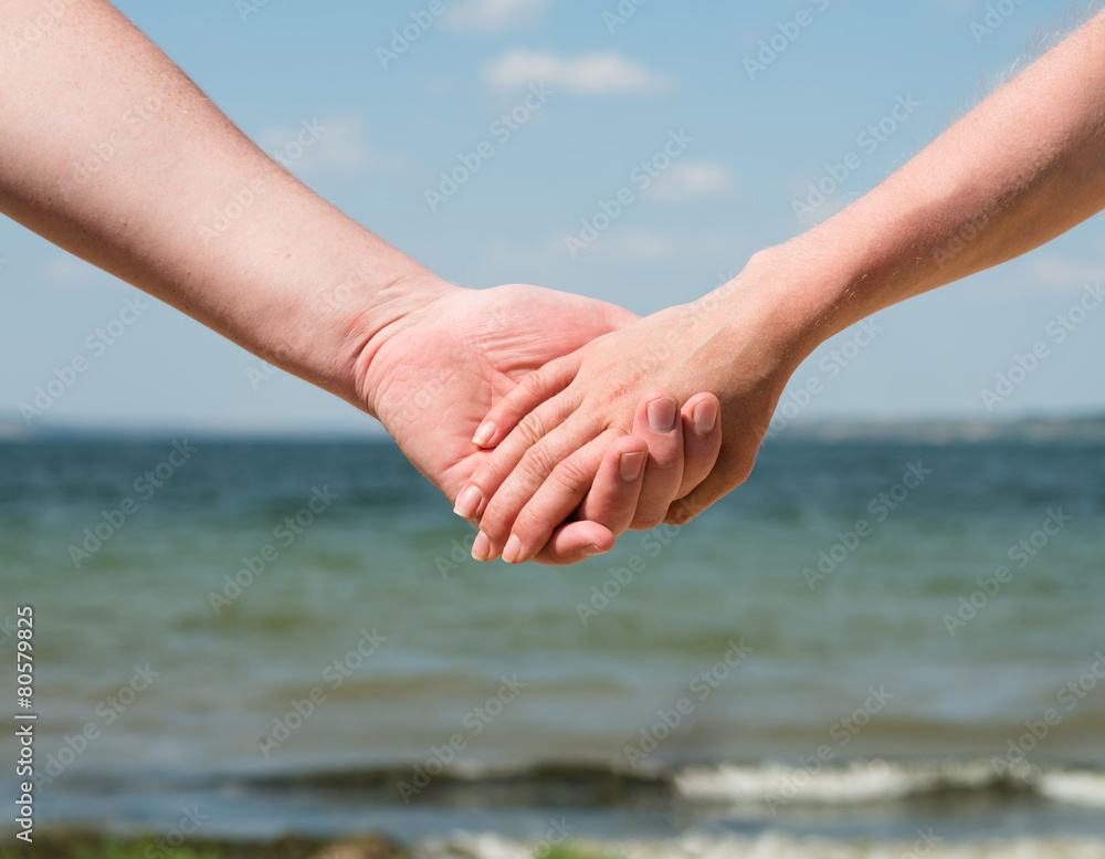 Hand Holding in Sea Background Hand Holding in Sea Background