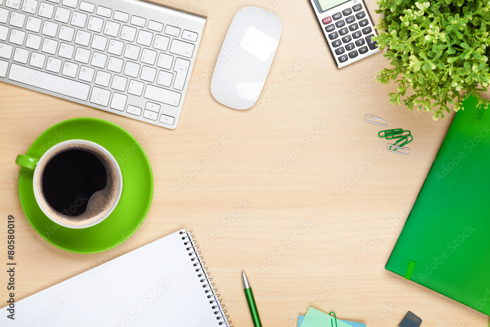 Office table with coffee cup, computer and flower Office table with coffee cup, computer and flower