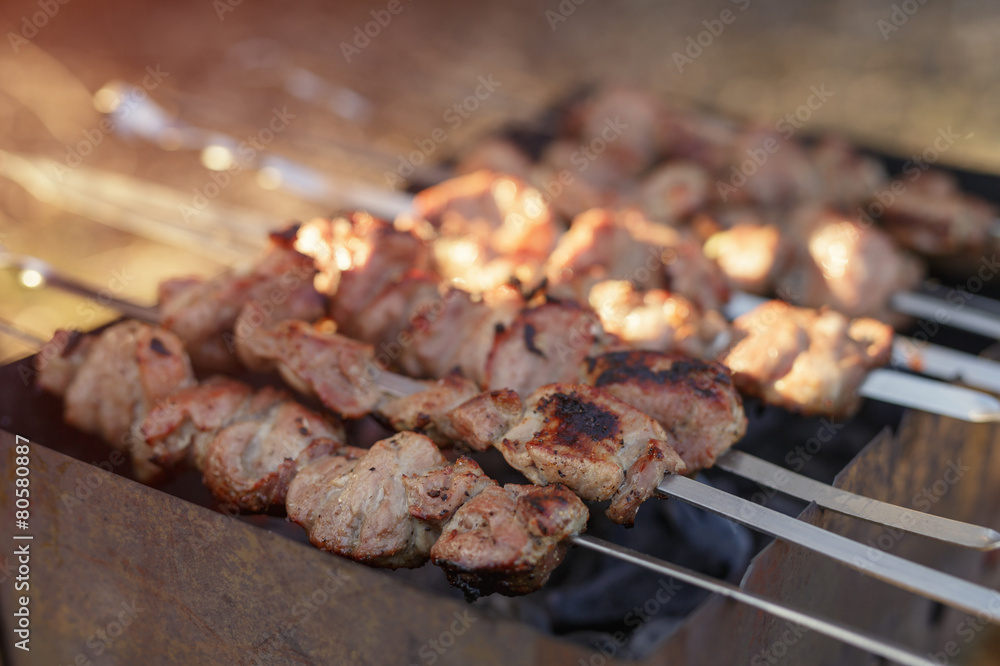 cooking pork shashlik on skewer in mangal outdoor food