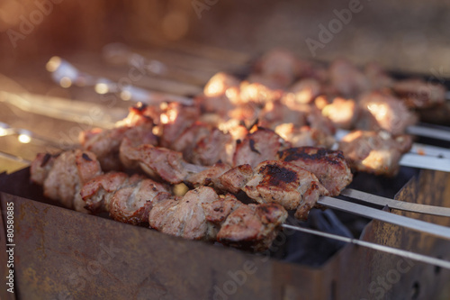 cooking pork shashlik on skewer in mangal outdoor food