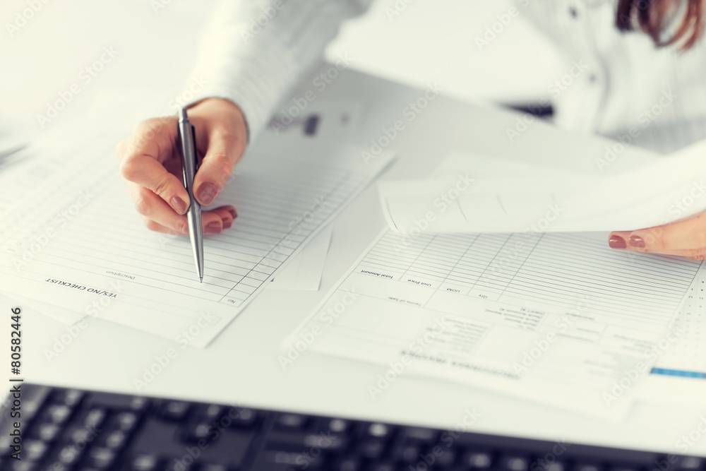 woman hand filling in blank paper or document woman hand filling in blank paper or document
