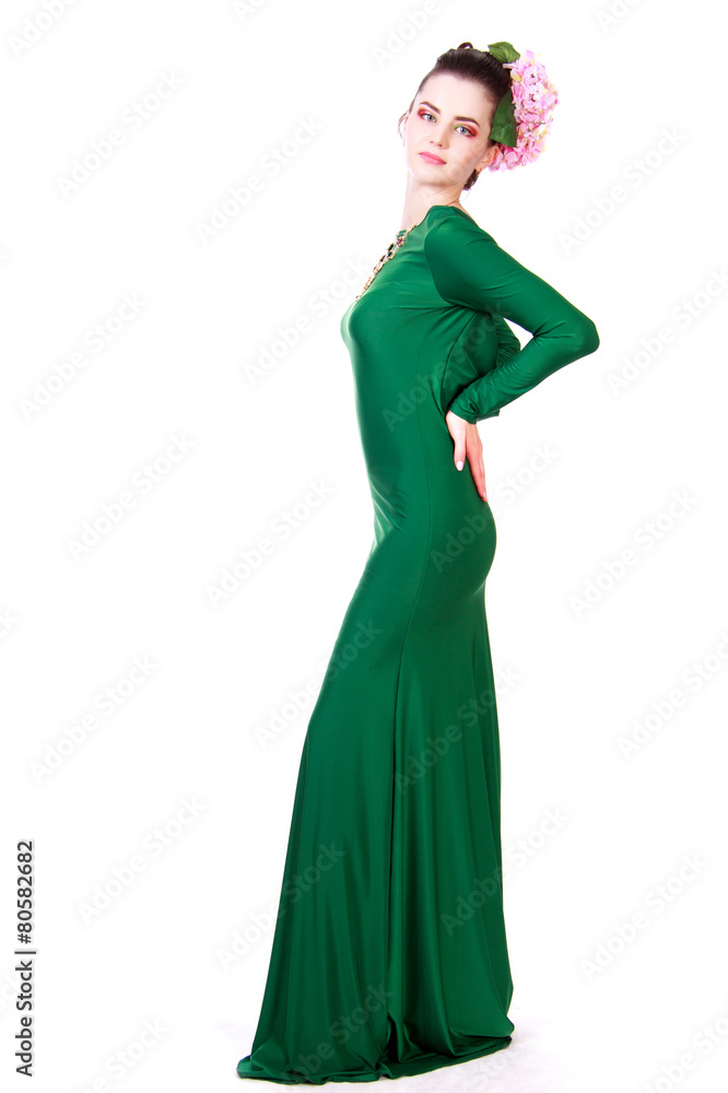 Beautiful young woman in a green evening dress Beautiful young woman in a green evening dress