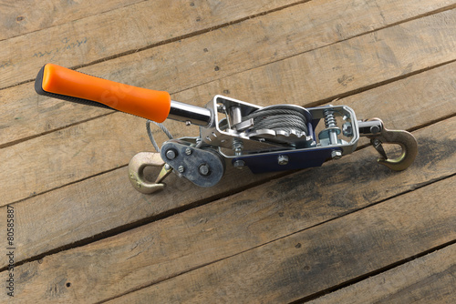 Photography hand power puller tool on wood background