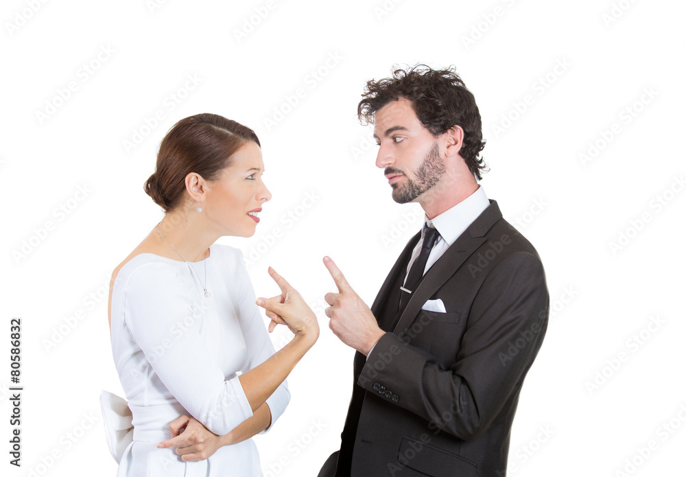 couple pointing fingers at each other, blaming each other couple pointing fingers at each other, blaming each other