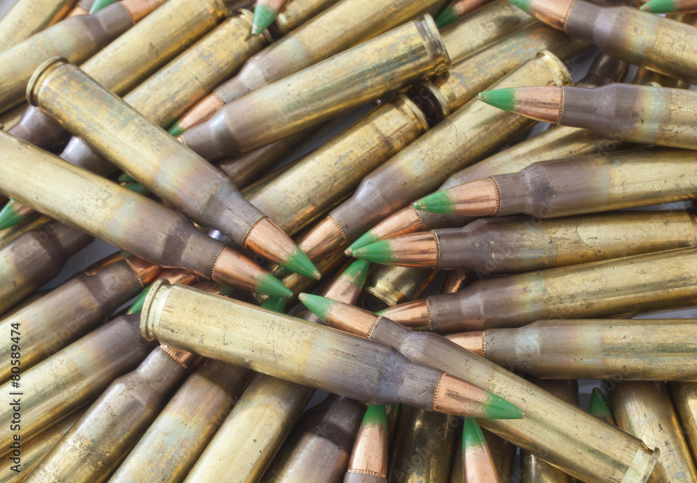 Pile of cartidges with green tipped bullets Pile of cartidges with green tipped bullets
