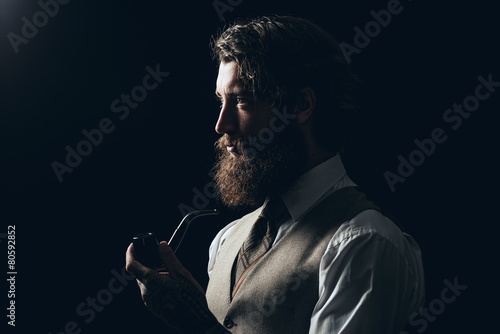 Silhouette Man with Beard Holding Smoking Pipe photo