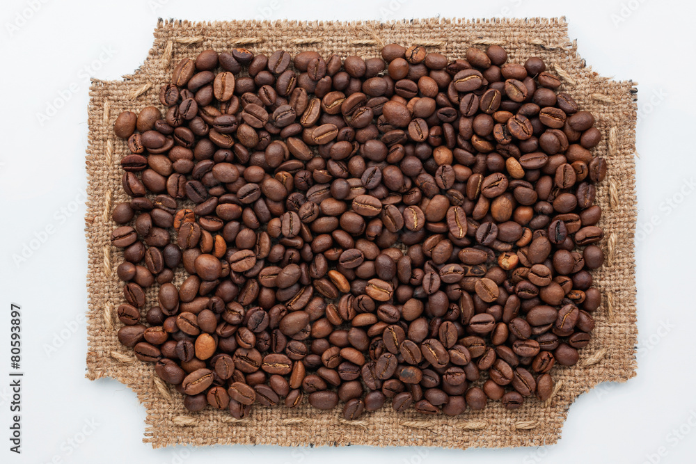 Fototapeta premium Figured frame made of burlap and coffee beans