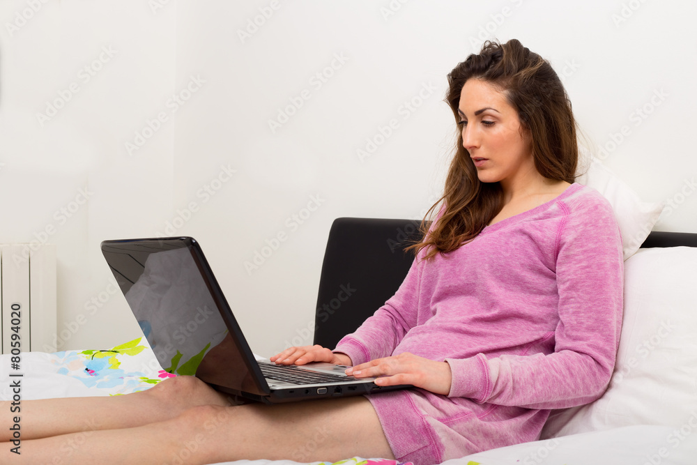 young woman working on her laptop