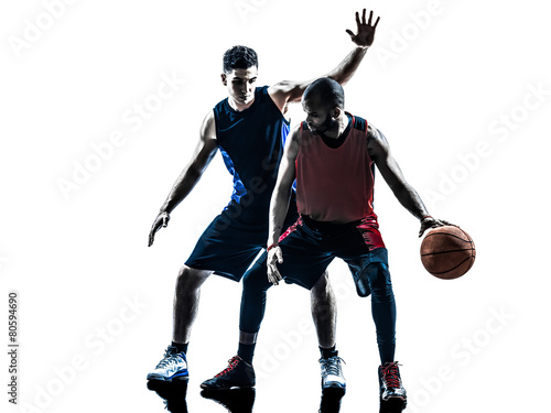 Fototapeta Naklejka Na Ścianę i Meble -  caucasian and african basketball players man silhouette