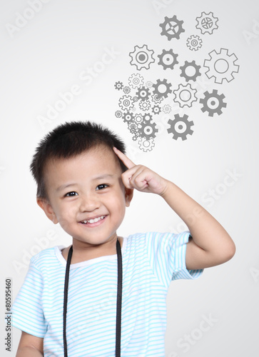 Happy Kid thinking with gear wheel © jeffy1139