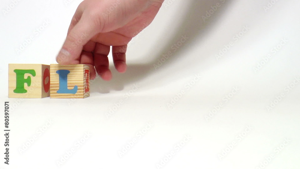The video shows Flowers word built of wooden blocks The video shows Flowers word built of wooden blocks