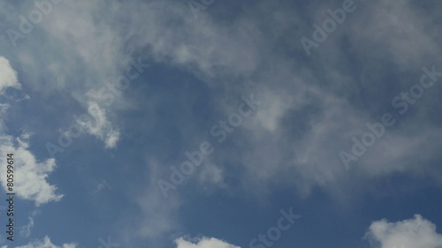 Timelapse floating clouds on a blue sky over the city 4K