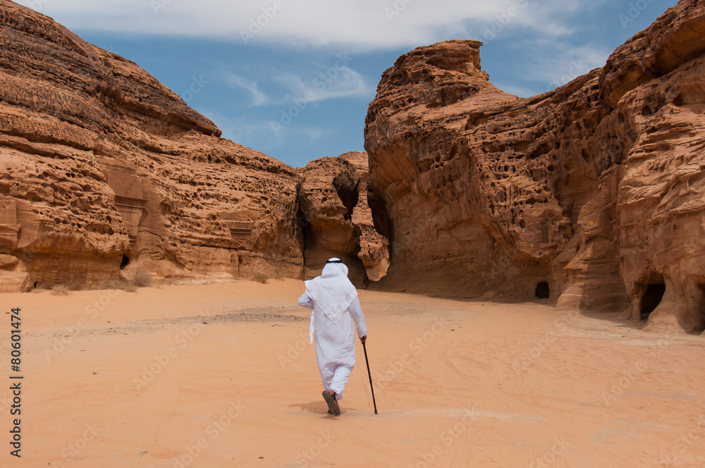 Saudian walking in Madaîn Saleh archeological site, Saudi Arabi Saudian walking in Madaîn Saleh archeological site, Saudi Arabi