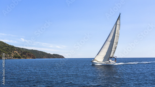 Sailboats participate in sailing regatta. Luxury Yachts. © De Visu