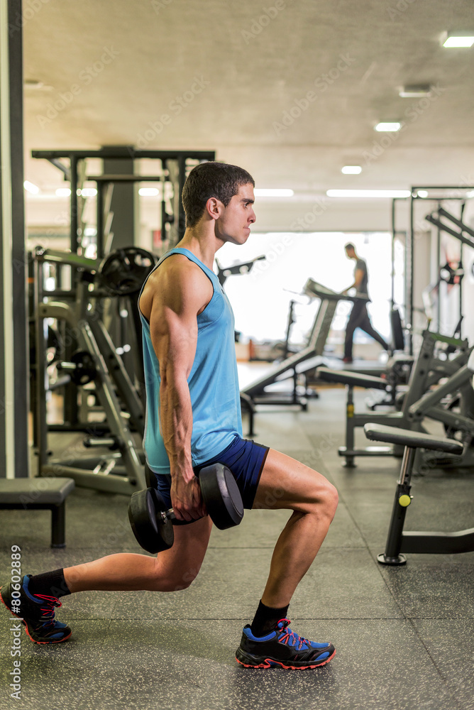 Young man trining at gym Young man trining at gym