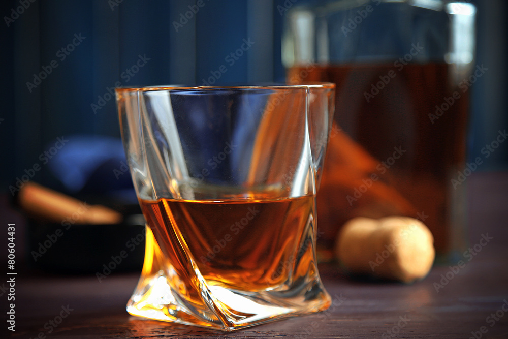 Fototapeta premium Whiskey on wooden background