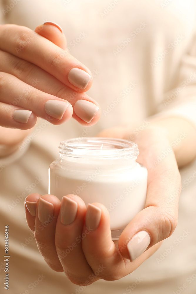 Female hand with cream, closeup Female hand with cream, closeup
