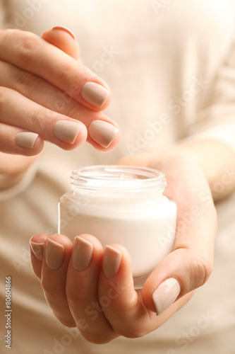 Female hand with cream, closeup