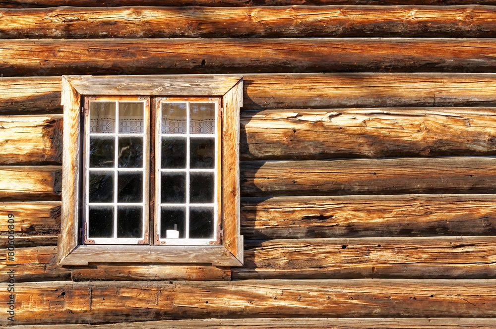 Norwegian wall of logs with window Norwegian wall of logs with window