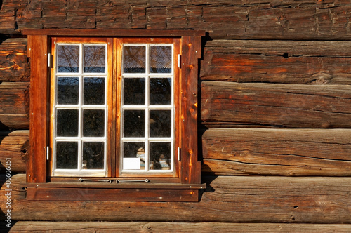 Norwegian wall of logs with window photo