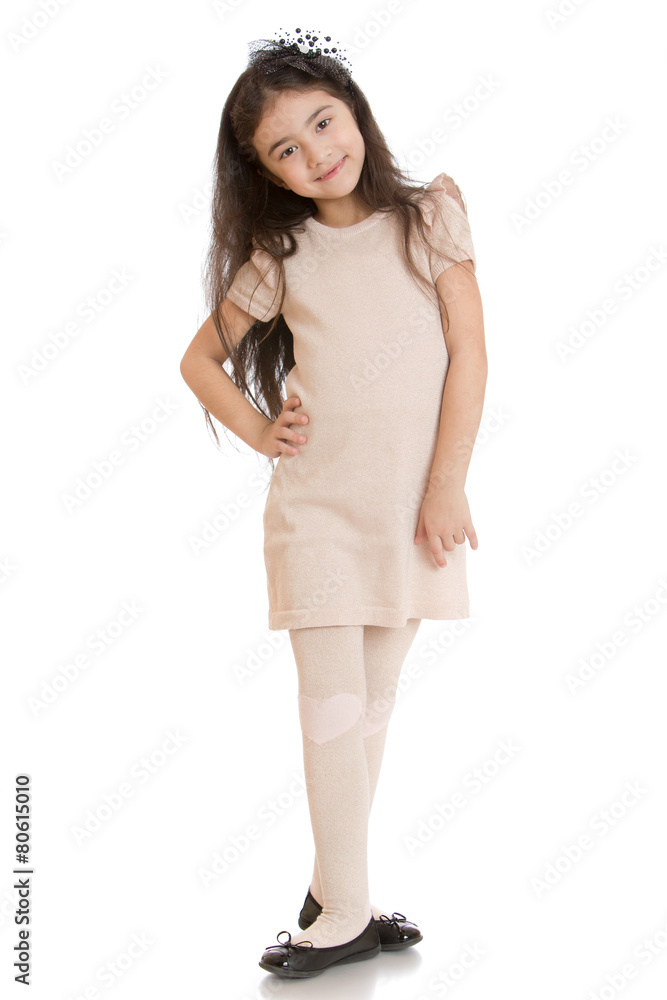 Dark haired girl posing in dress beige Dark haired girl posing in dress beige