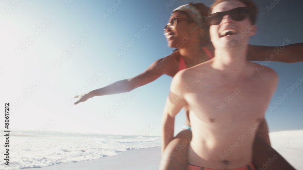 Guy piggybacking his Afro girlfriend who is pretending to fly Guy piggybacking his Afro girlfriend who is pretending to fly