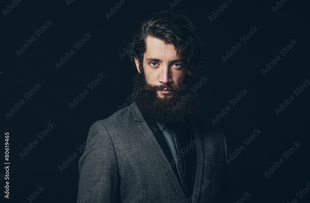 Young Man with Long Beard Looking at Camera