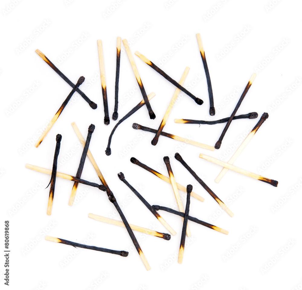 Burned matches on white background Burned matches on white background