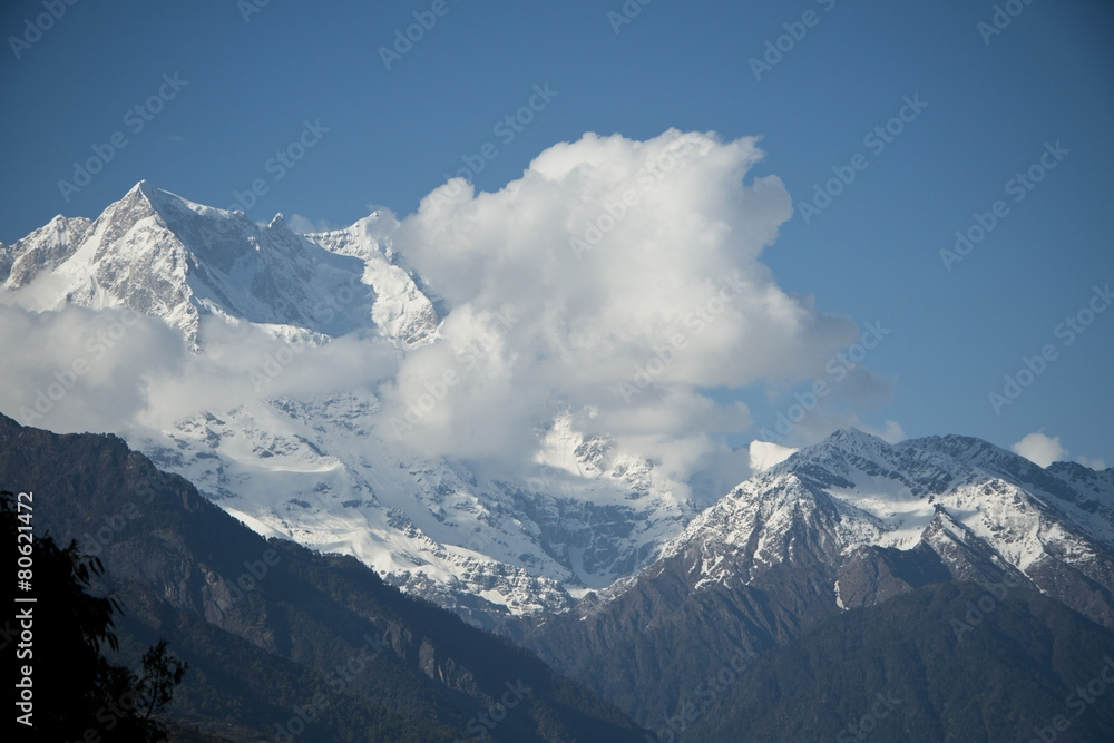 Clouds over the snowcapped mountains, Himalayas, Uttarakhand, In