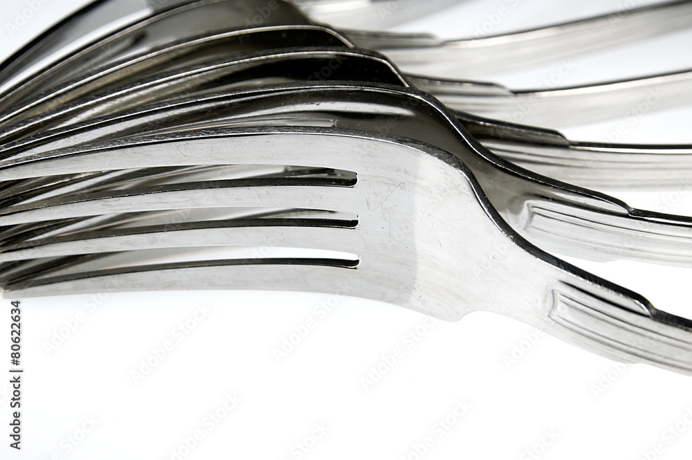 Forks arranged in series on the kitchen table. Forks arranged in series on the kitchen table.
