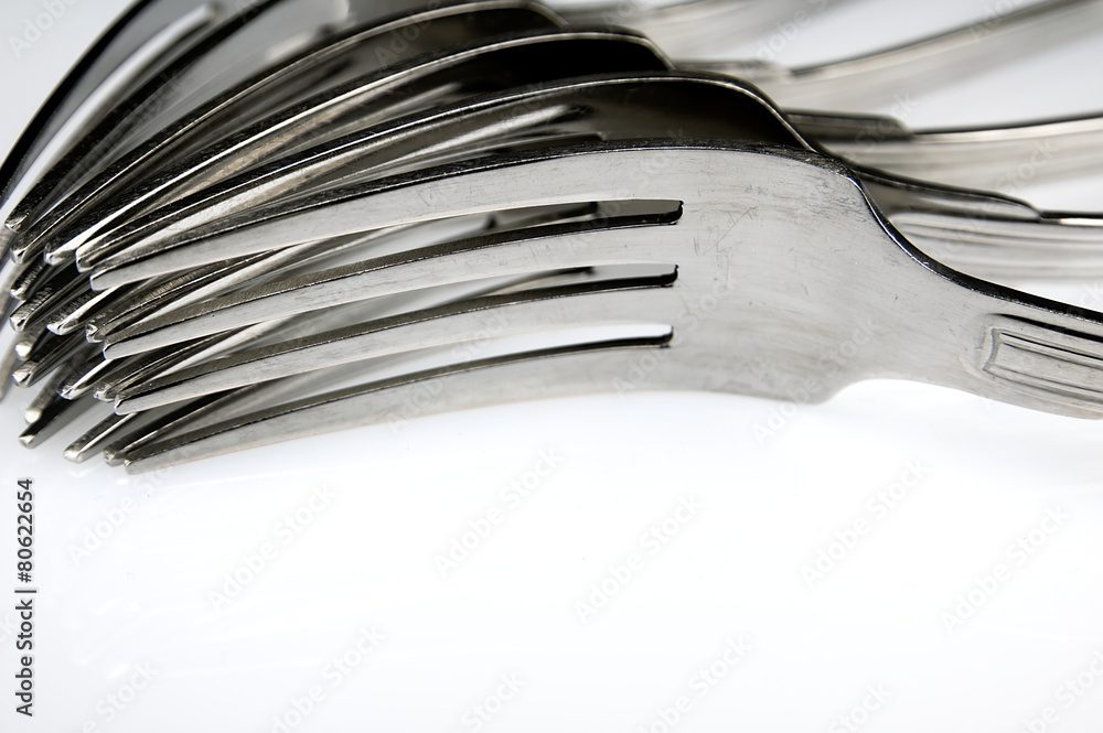 Forks arranged in series on the kitchen table. Forks arranged in series on the kitchen table.