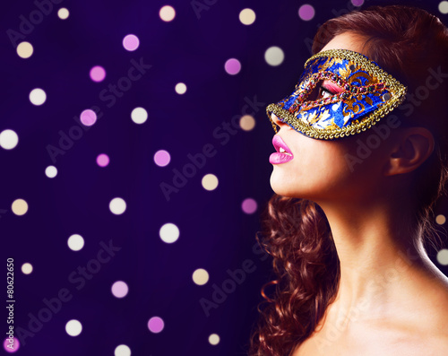Beautiful girl with masquer...