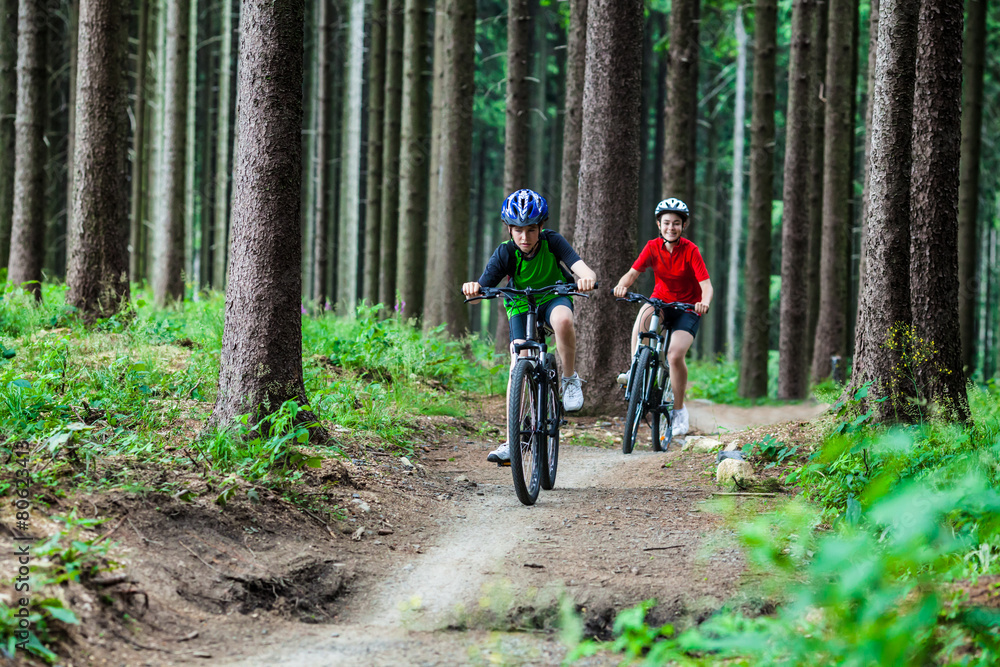 Healthy lifestyle - teenage girl and boy biking Healthy lifestyle - teenage girl and boy biking