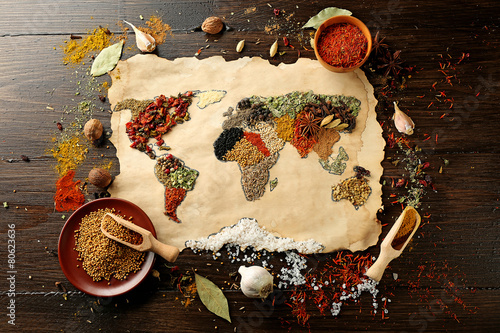 Fototapeta Naklejka Na Ścianę i Meble -  Map of world made from different kinds of spices on wooden background