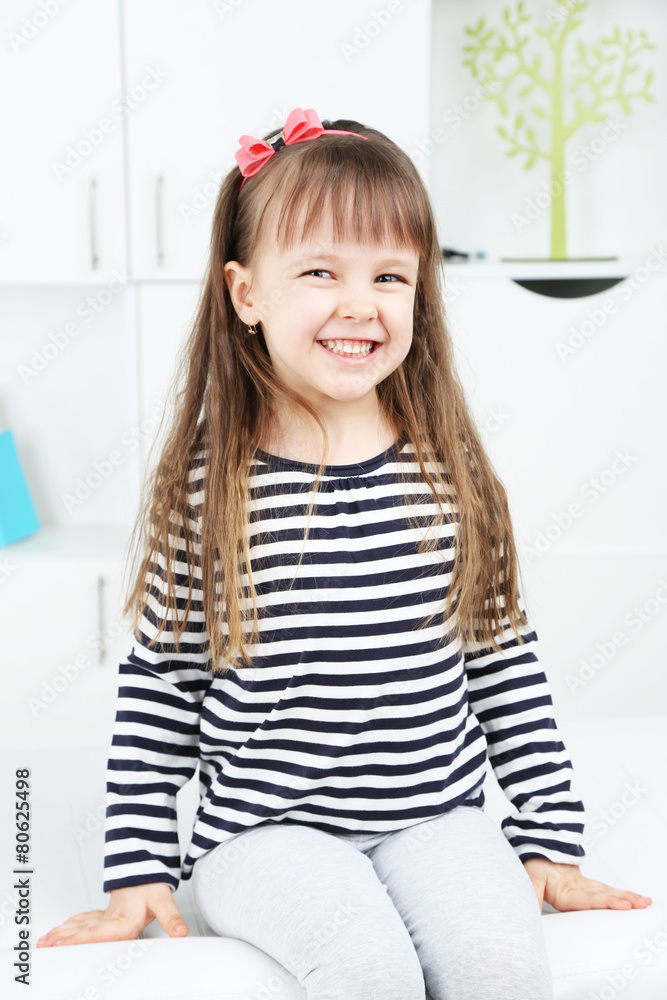 Portrait of cute little girl on home interior background Portrait of cute little girl on home interior background