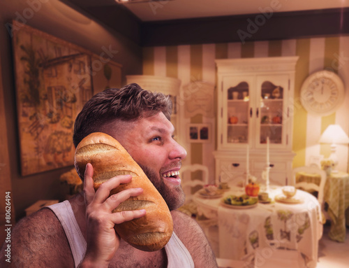 Strange man listening to something in bread photo